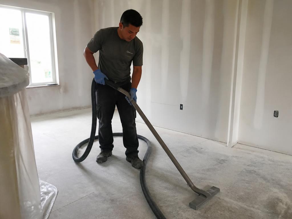 Worker cleaning a newly built room
